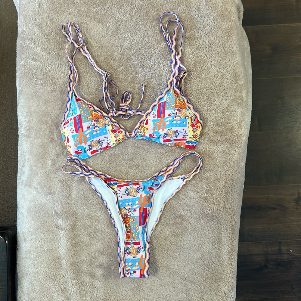 bikini new, size small, no brand, pink,  blue, yellow new without tags